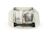 a silver ring with a cat sitting on top of it