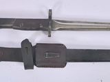 two knives that are laying next to each other on a table