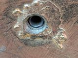 a close up of a piece of wood with a hole in it
