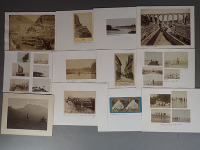 many old photographs of people and buildings on the wall