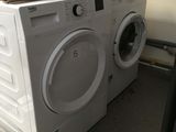 a white washer and a dryer sitting on top of each other