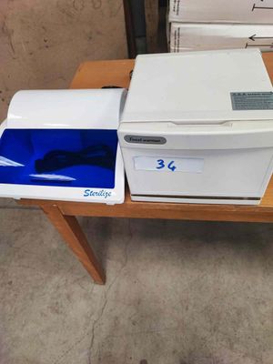 a white and blue printer sitting on a wooden table