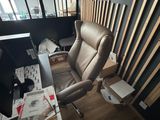 a chair that is sitting in front of a desk
