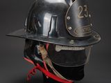 an old fireman ' s helmet with a number 23 on it