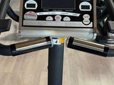 an image of a gym room with a tread machine and other equipment on the floor