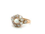 an image of a pearl and diamond ring on a white background