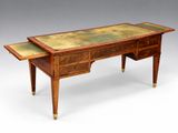 an antique writing desk with two drawers and a marble top