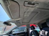 a view of the inside of a car from the driver ' s seat