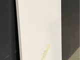 a picture of a white board leaning against a black wall