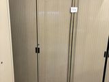 a metal cabinet in the middle of a room