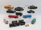 a lot of different toy vehicles on display on a white surface