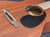 an image of a close up of an acoustic guitar with strings