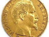 an image of a close up of a gold coin with a man ' s face
