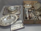 a box of silverware on a table next to a box of silverware