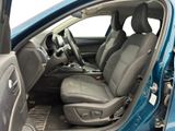 the interior of a car with the door open and the seats down