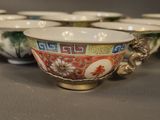 five bowls with different designs on them on a table