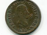Gros plan sur une pièce de monnaie portant le visage d'un homme