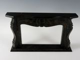 an image of a black marble console table with a carved top