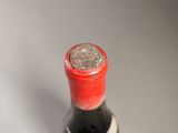 a bottle of wine that is sitting on a table