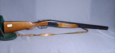 a shotgun that is sitting on top of a table