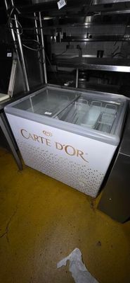 a cart that has some food inside of it