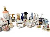 many different types of vases and other items on the table