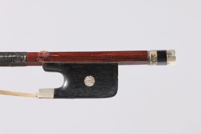 violin bow made of wood and metal on a white background
