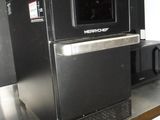 a microwave sitting on top of a metal shelf