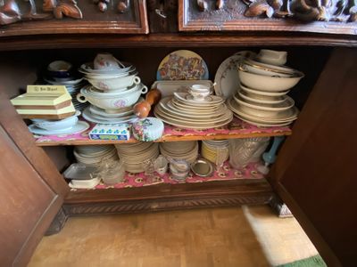 a cabinet with a lot of plates and bowls on it