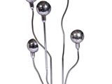a metal sculpture of a bunch of balls on top of a table