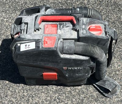 a black and red blower sitting on the ground