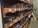 a lot of shelves in a warehouse with many items on them
