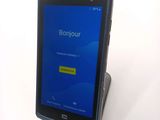 a cell phone that is sitting on top of a stand
