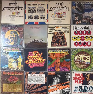 a lot of records on the wall of a room