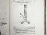 an open book with a drawing of a man sitting on a bench