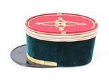 a red and green hat on a black tray