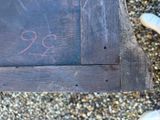 a wooden bench that has a chalk drawing on it
