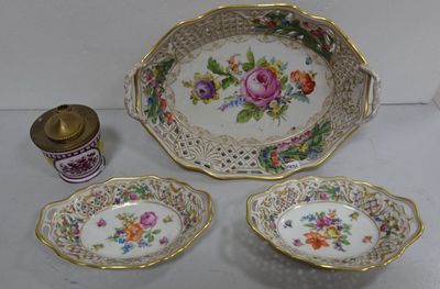 three plates and a bowl sitting on a table
