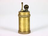 an antique brass cigarette case with a horse on top of it