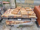 a pile of bricks sitting on top of a pallet