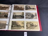 a book with pictures of trains on it on a table