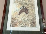 a picture of a horse in a picture frame on the wall