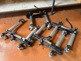 four different types of hydraulic jacks sitting on the floor