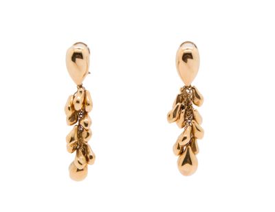 a pair of gold earrings with a teddy bear on them