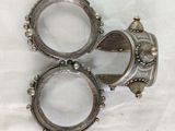 three silver rings sitting on top of a white cloth