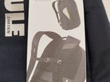 a black backpack with a white label on it