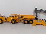 a toy truck with a bulldozer and a bulldozer on it