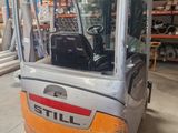 a forklift that is parked in a warehouse
