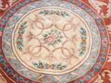 a rug with a flower design on it on the floor