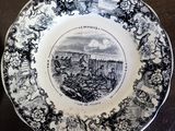 a black and white plate with a picture on it